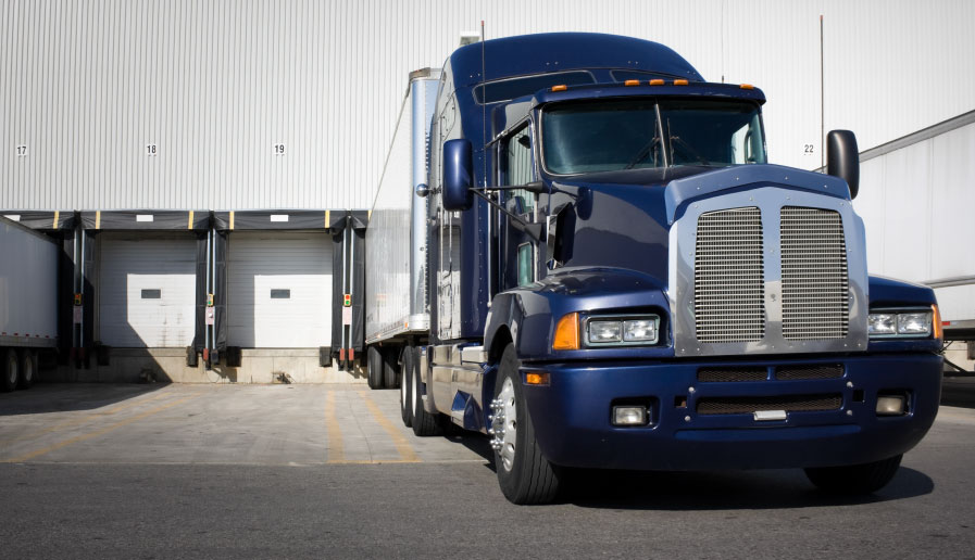 Truck parked in front of bay doors