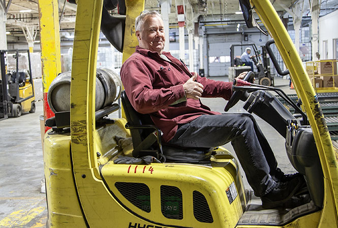 Man operating a fortlift